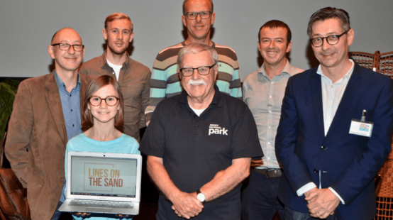LOCAL TECH FIRM HELPS SCHOOLCHILDREN DRAW THEIR LINES ON THE SAND