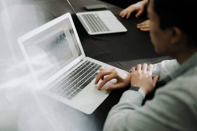 Business Analyst using a laptop to deliver insights from data