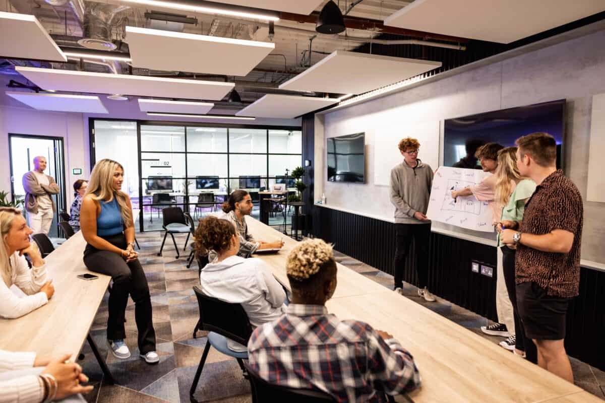 Students in the Digital Jersey Academy Lecture hall presenting group work 