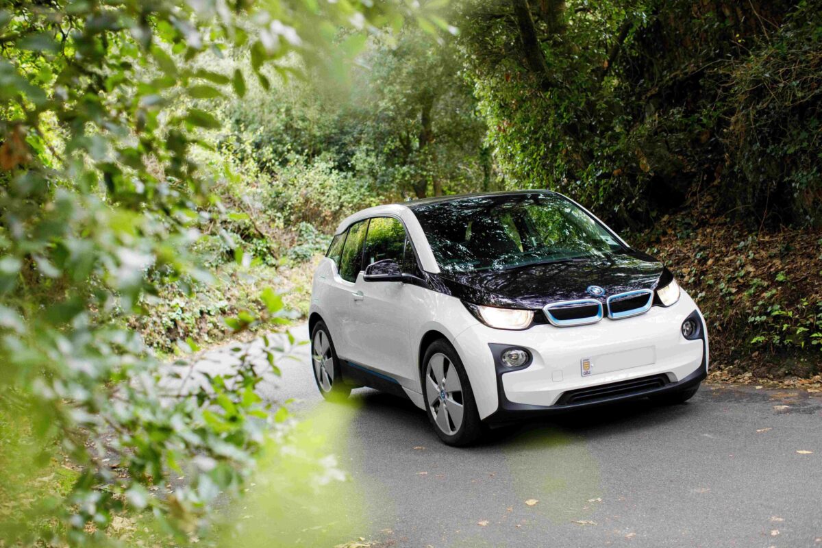 EV Electric car driving through Jersey's green lanes