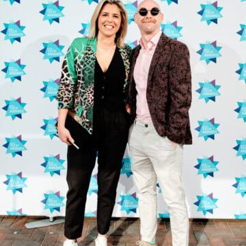 two people stood outside TechAwards posing for photo