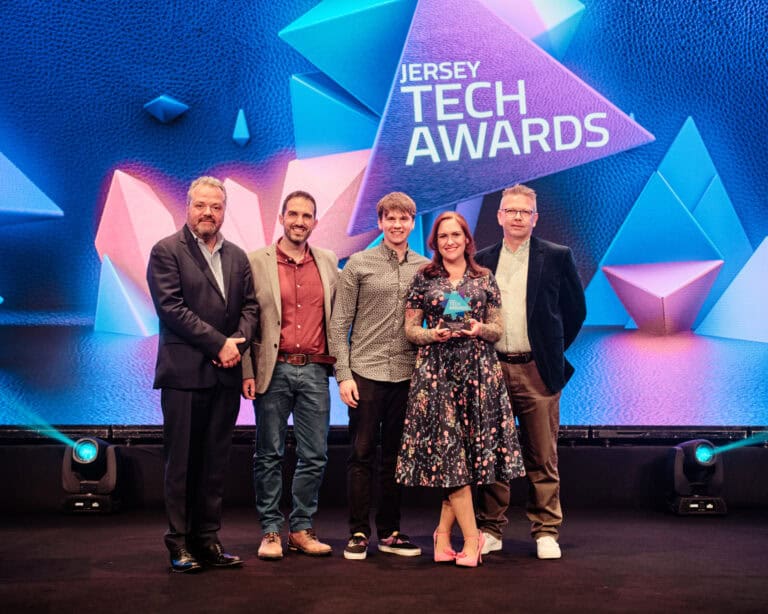 Start-Up Award Winner, Reel Creative, stood on stage with award and host Hal Cruttenden
