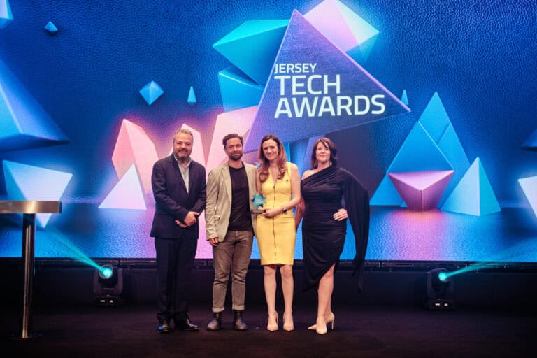 Creative Award Winner, Anova, stood on stage with award and host Hal Cruttenden