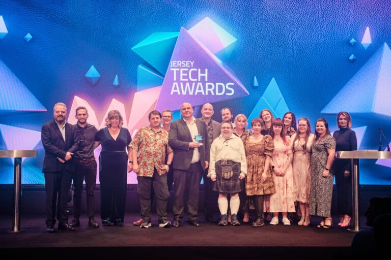 Cyber Security Award Winner, JCSC, Soteria and CIISF, stood on stage with award and host Hal Cruttenden