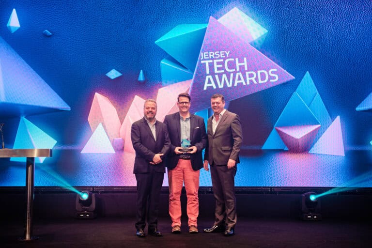 Leadership Award Winner, Paul Fosse, stood on stage with award and host Hal Cruttenden