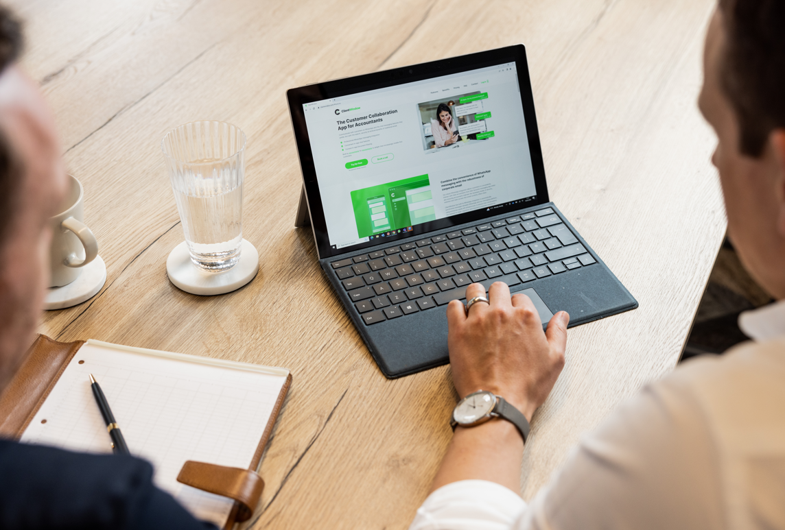 Photo of someone working on a laptop, looking at the screen